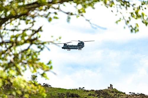 Chinook helicopter flying low over trees